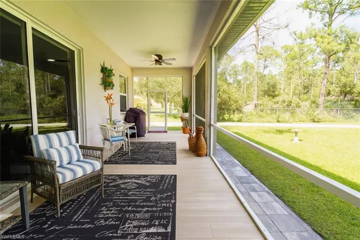 Sunroom / solarium with a ceiling fan