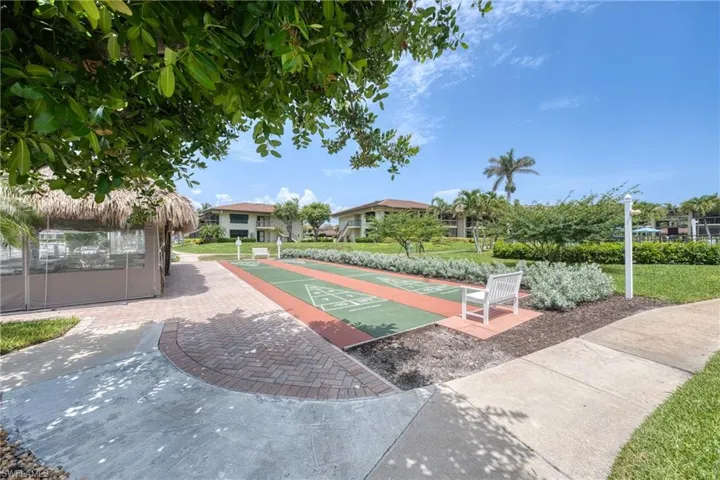 View of home's community with shuffleboard