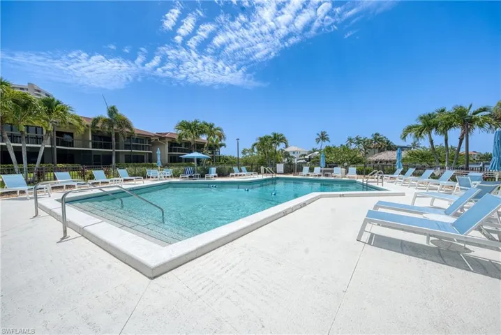 Community pool featuring a patio