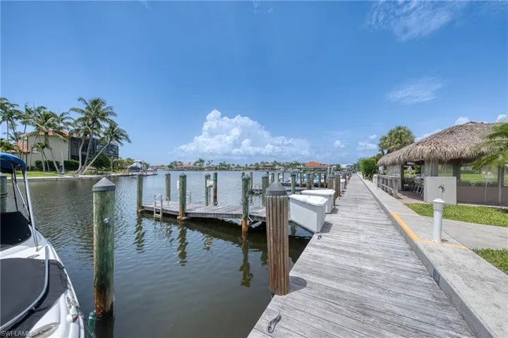 Dock area with a water view and a gazebo