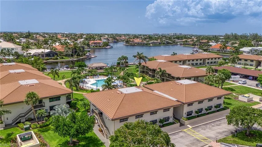 Aerial view of residential area featuring a large body of water