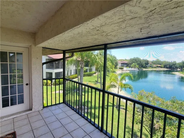 Unfurnished sunroom with a water view