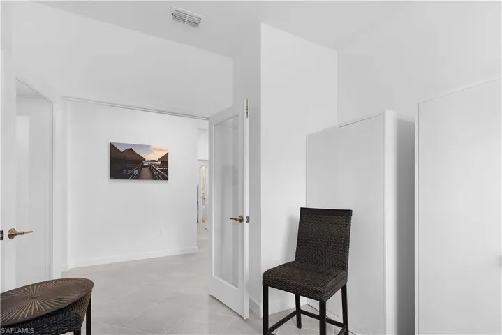 Sitting room featuring baseboards and light tile patterned floors