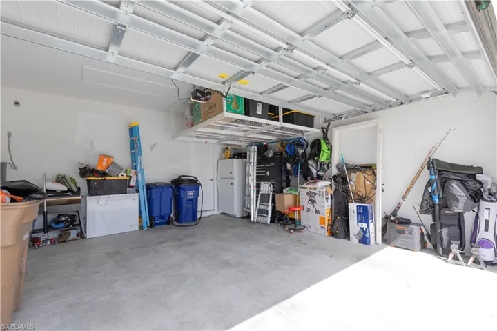Garage with freestanding refrigerator