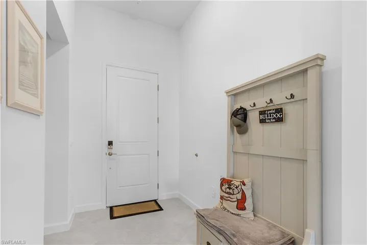 Mudroom with baseboards and light tile patterned flooring