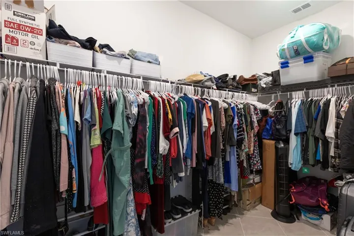 Spacious closet with tile patterned flooring
