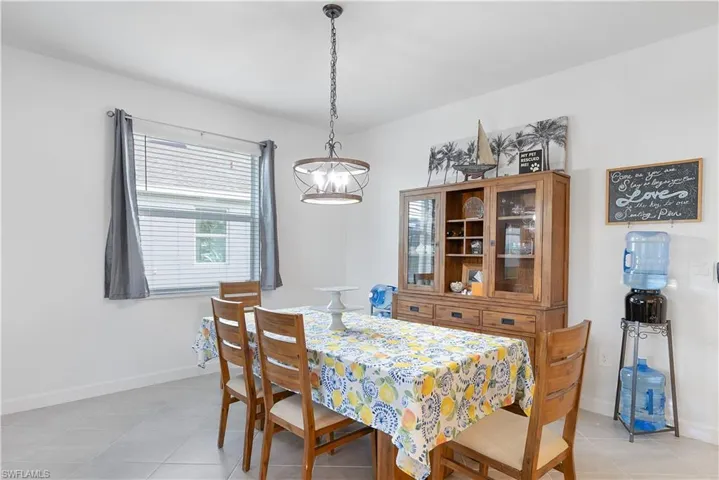 Dining area featuring light tile patterned floors