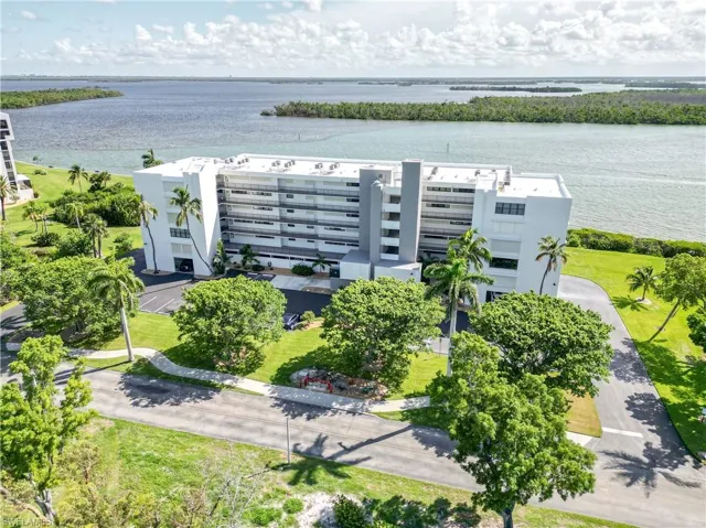 Birdseye aerial view featuring water views of the back bay of Estero Island