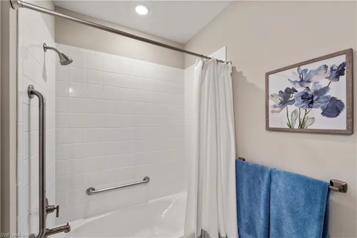 Bathroom with shower / bath combo with shower curtain