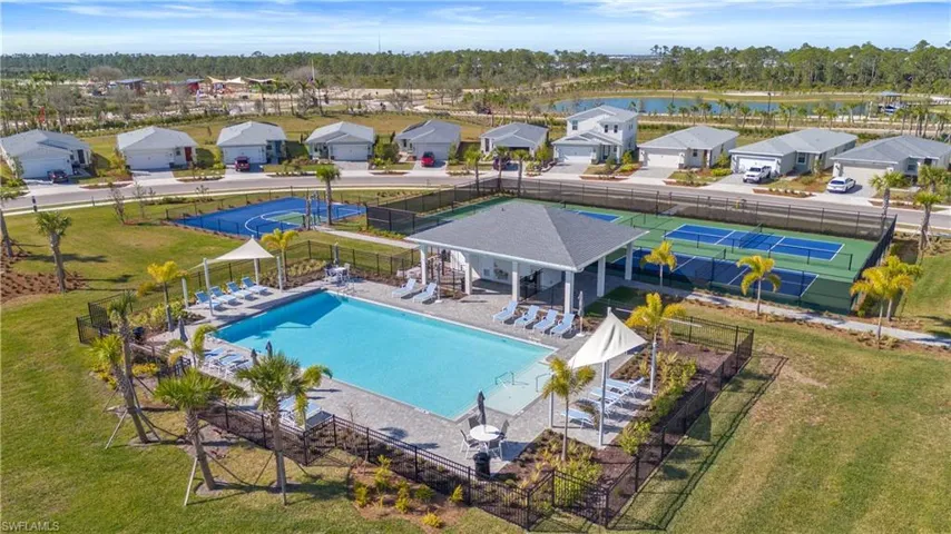 View of swimming pool with a patio and a water view