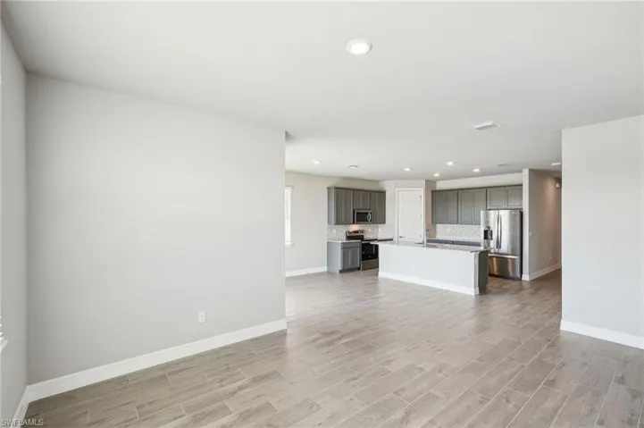 Unfurnished living room featuring light hardwood / wood-style floors