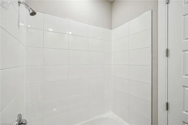 Bathroom featuring tiled shower / bath