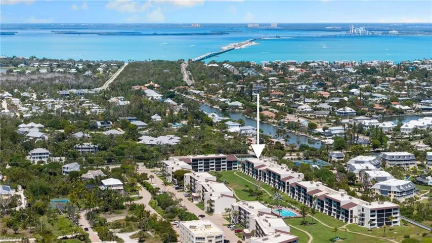 Aerial perspective of suburban area with a nearby body of water