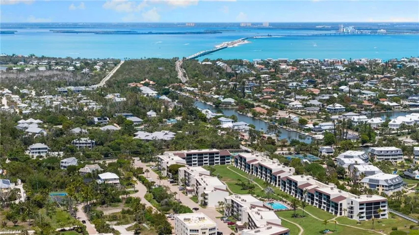 Aerial perspective of suburban area with a nearby body of water
