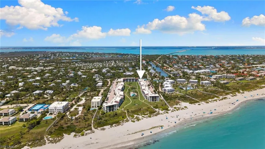 Aerial view of waterfront with a beach