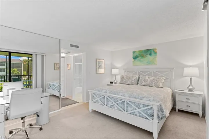 Primary Bedroom featuring a closet and an office area