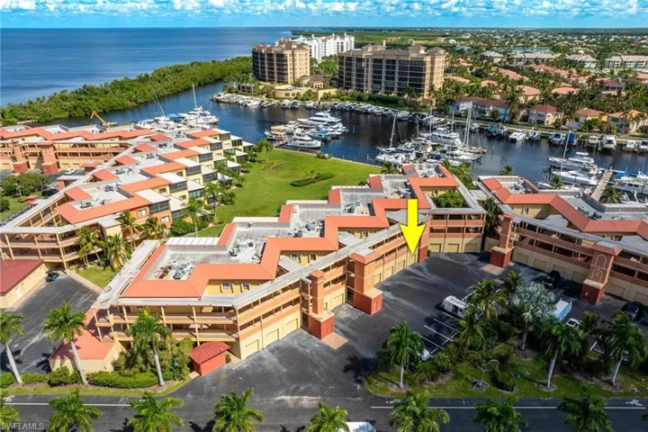 Aerial view of a marina and a large body of water
