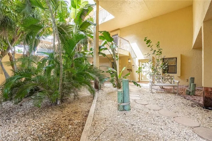 View of yard with a balcony