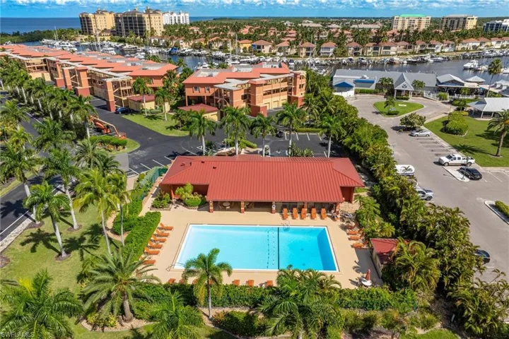 Aerial view of apartment complex and a nearby body of water