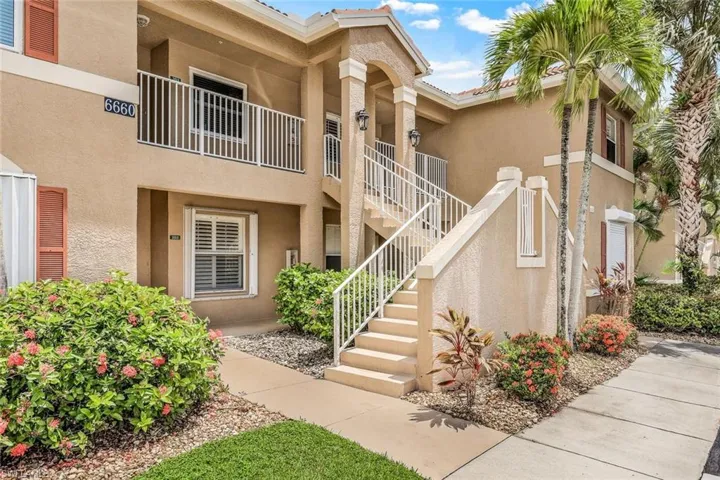 View of front of house with a balcony