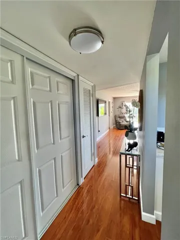 Corridor with wood-type flooring