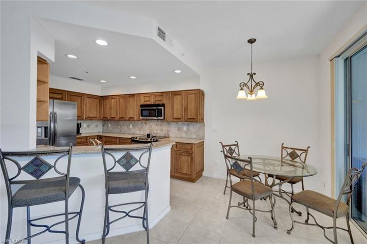 Kitchen with breakfast bar and separate dining area.