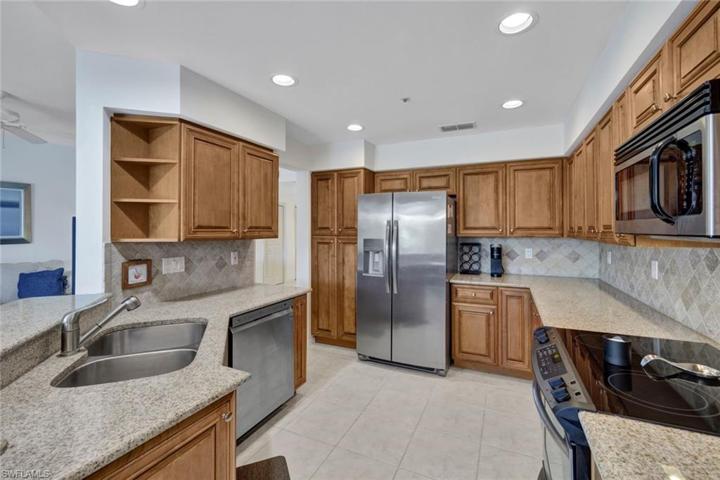 Oak cabinets and granite counter-tops contribute to the clean and modern feel of this home.
