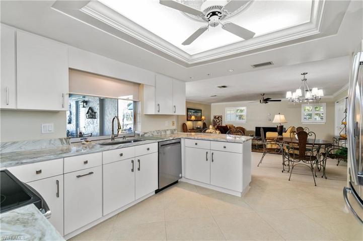 Kitchen has pass-through that pockets open. New marble counter-tops throught the house.