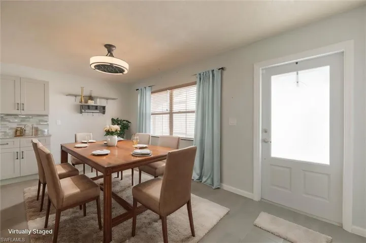 Virtually-staged view of dining space