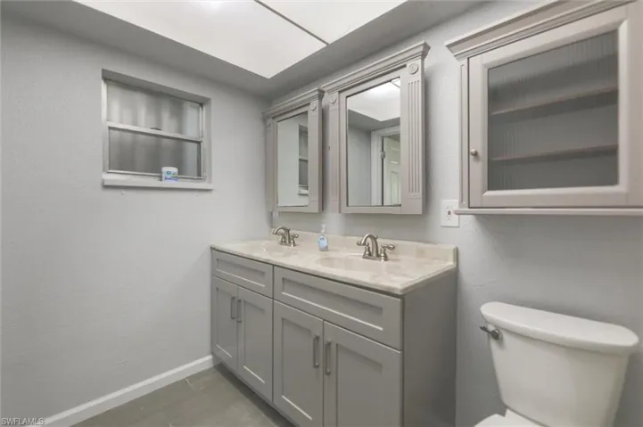 Bathroom featuring vanity and toilet