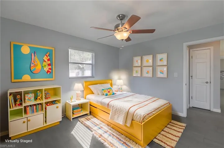 Virtually-staged Bedroom featuring dark hardwood / wood-style tile floors and ceiling fan