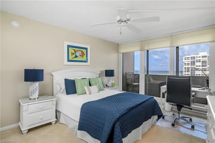 Bedroom featuring ceiling fan and access to outside