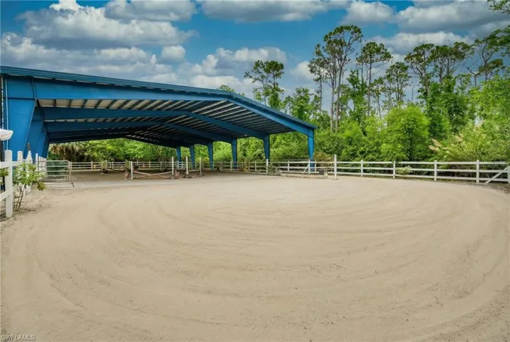 This exceptional 5.65-acre property offers a rare combination of space, infrastructure, and versatility—ideal for business owners, contractors, landscapers, small industrial users, and custom home developers seeking a flexible and functional setting.The property is improved with multiple large-scale structures, including a 130’ x 80’ steel-covered building with lighting and a 170’ x 80’ open-span arena, both easily adaptable for equipment storage, workshop space, fabrication, or covered operations. A su