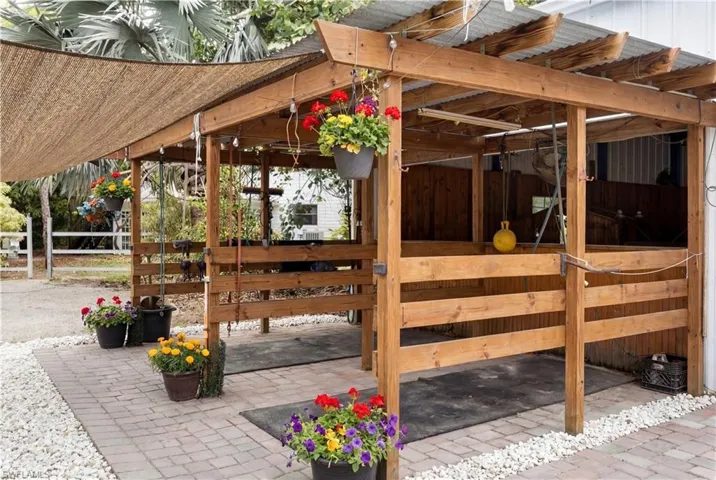 This exceptional 5.65-acre property offers a rare combination of space, infrastructure, and versatility—ideal for business owners, contractors, landscapers, small industrial users, and custom home developers seeking a flexible and functional setting.The property is improved with multiple large-scale structures, including a 130’ x 80’ steel-covered building with lighting and a 170’ x 80’ open-span arena, both easily adaptable for equipment storage, workshop space, fabrication, or covered operations. A su