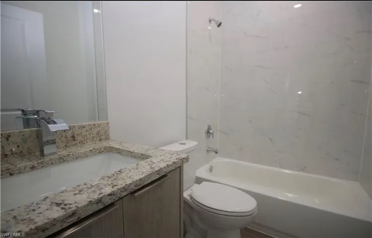 Full bathroom with vanity and  shower combination