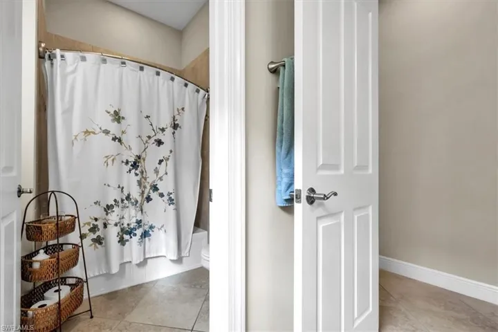 Large guest bath with separate water closet and shower.