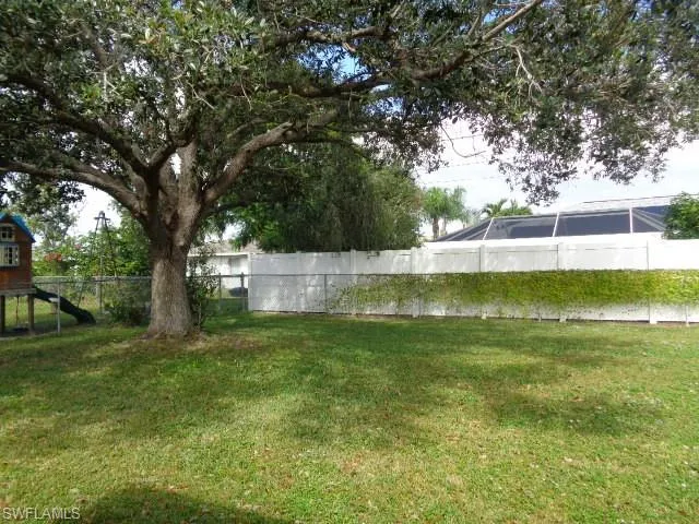 View of yard featuring a sunroom