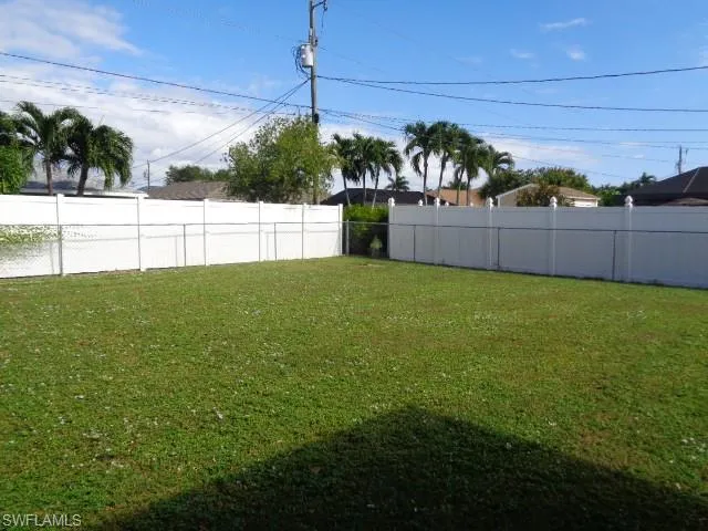 View of fenced backyard