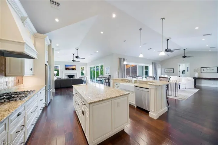 This 5+ bed room home has volume ceilings and sets of double sliding doors let in an abundance of natural light