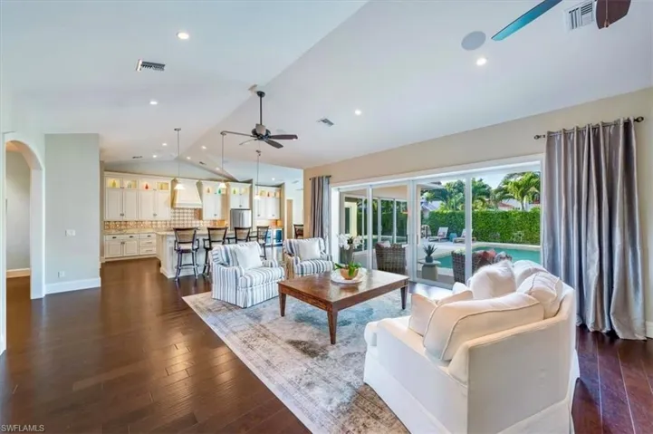 Curved archways, walnut flooring throughout and built-in speakers are just a some of the many features of this well-designed home