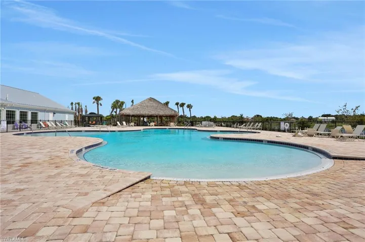 Community pool with a patio area