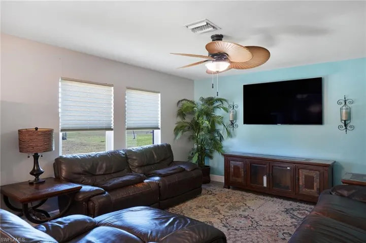 Living room featuring ceiling fan