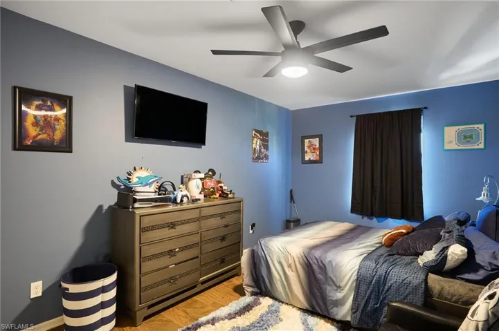 Bedroom featuring ceiling fan and light hardwood / wood-style floors
