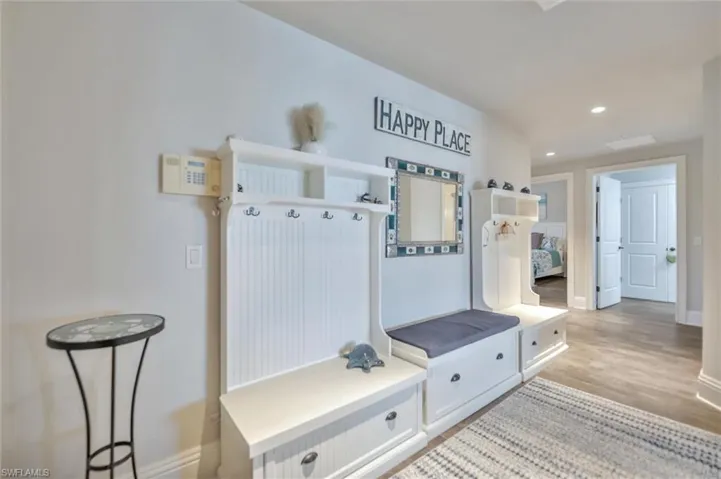 Mudroom featuring recessed lighting and light wood finished floors