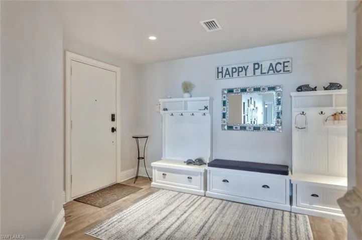 Mudroom with light wood-style flooring and recessed lighting