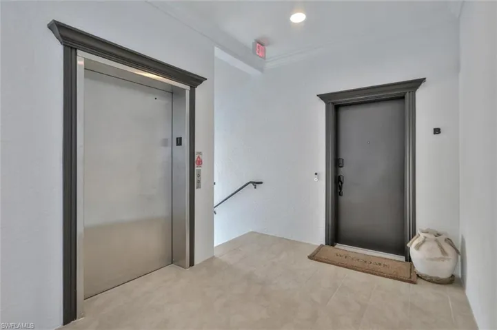 Entrance to property featuring elevator