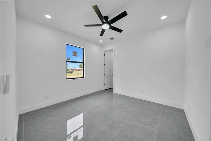 Spare room featuring recessed lighting and a ceiling fan
