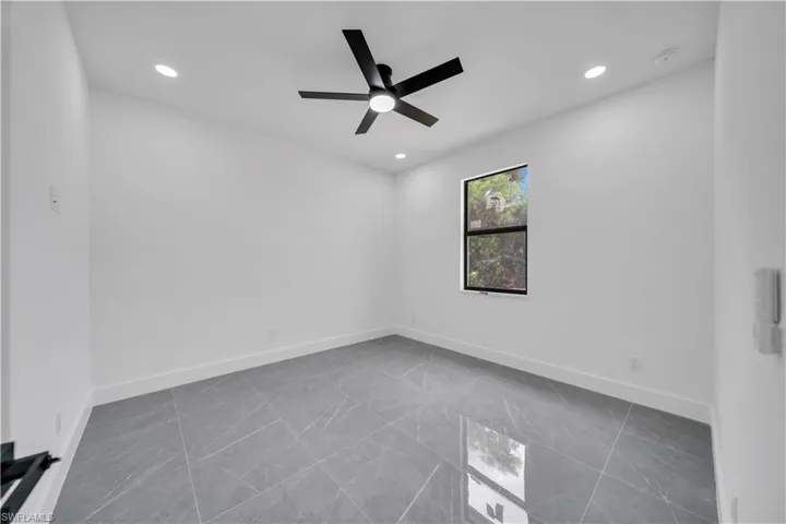 Spare room featuring recessed lighting and a ceiling fan