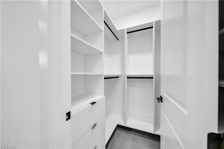 Spacious closet with tile patterned flooring