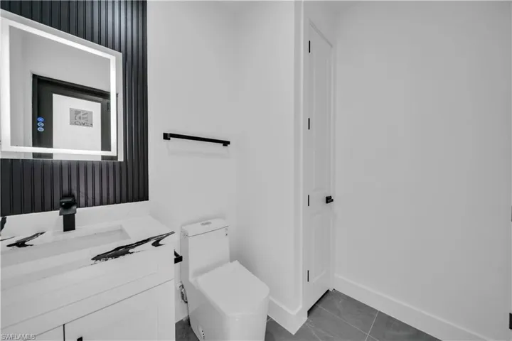 Bathroom with vanity and tile patterned flooring
